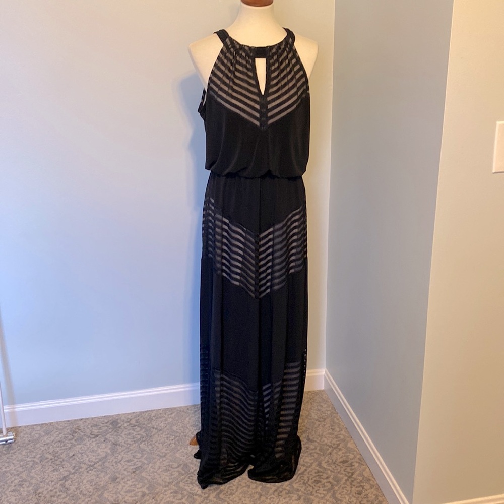 Gorgeous halter style London Times black gown with flesh color lining.
